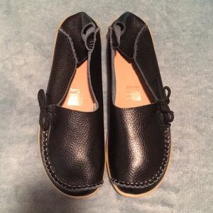 Black leather moccasin style slip ons for ladies NEW WITHOUT BOX